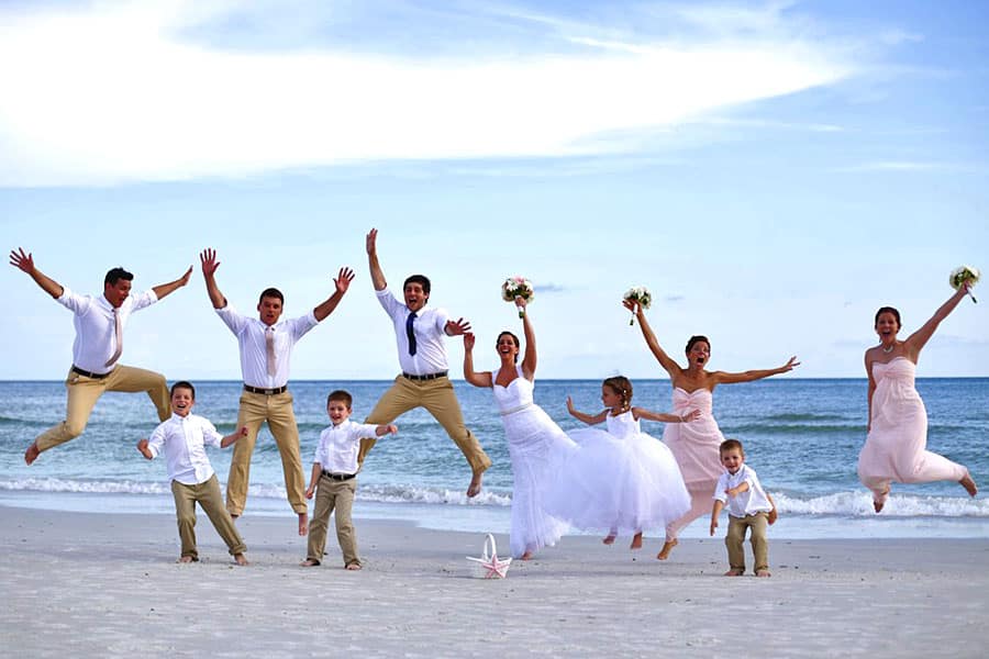Bridal Party Jumping on the Beach - Fun Bridal Party Group Photo - Florida Gulf Coast Beach Wedding Ceremony