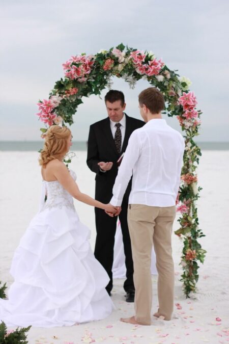 arch of love by florida sun weddings | beach wedding ceremony for Indra and Martin