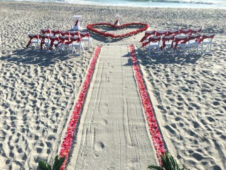 rose petal heart in the sand | Best Florida Beach Wedding Packages