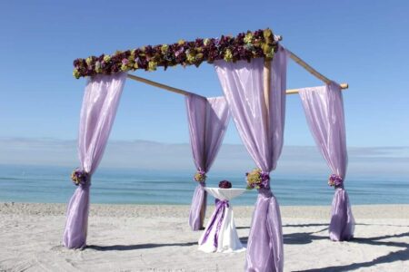 purple bamboo trellis for beach wedding in florida | floridasunwedding.flywheelstaging.com