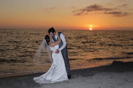 bride and groom kissing at sunset | Florida Beach Wedding Photographer in Sarasota