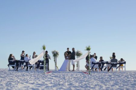 Black and White Elegant Beach Wedding Ceremony in Florida with White Columns | Destination Weddings Vow Renewals