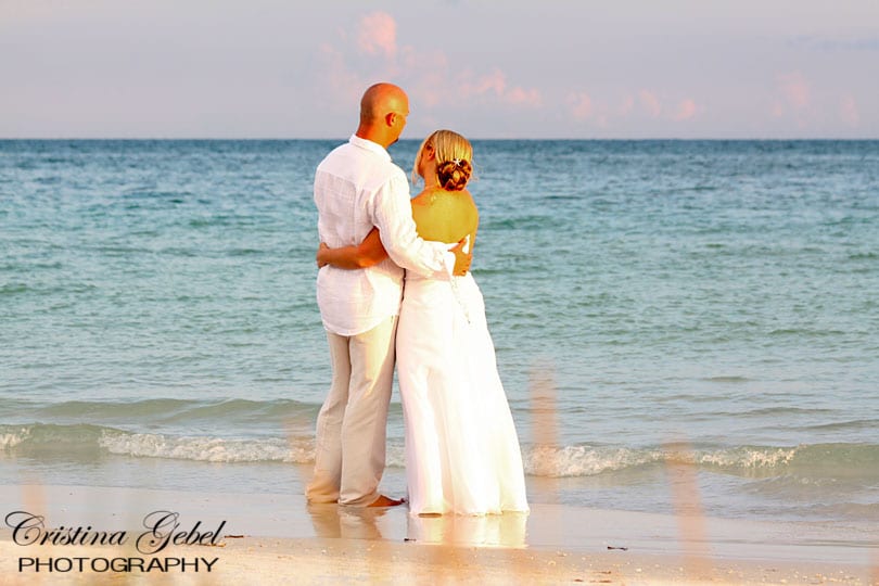 Bride and Groom in Traditional Beach Wedding Attire - Barefoot on the Beach Watching the Waves - Florida Beach Wedding Ceremonies and Photography