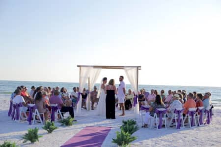 Ceremony Guests Seated in Circle Around the Wedding Couple | Florida Beach Wedding Packages
