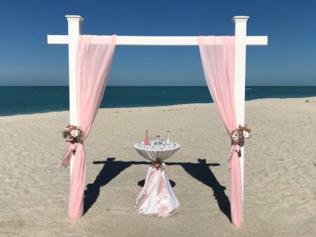 Seaside Paradise beach trellis in pink with decorated sand ceremony table