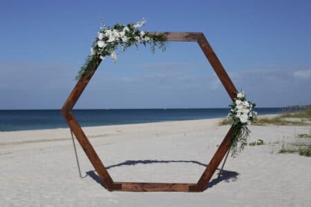 Boho Beach Wedding in Florida with Wooden Hexagon Backdrop and Asymmetrical Florals