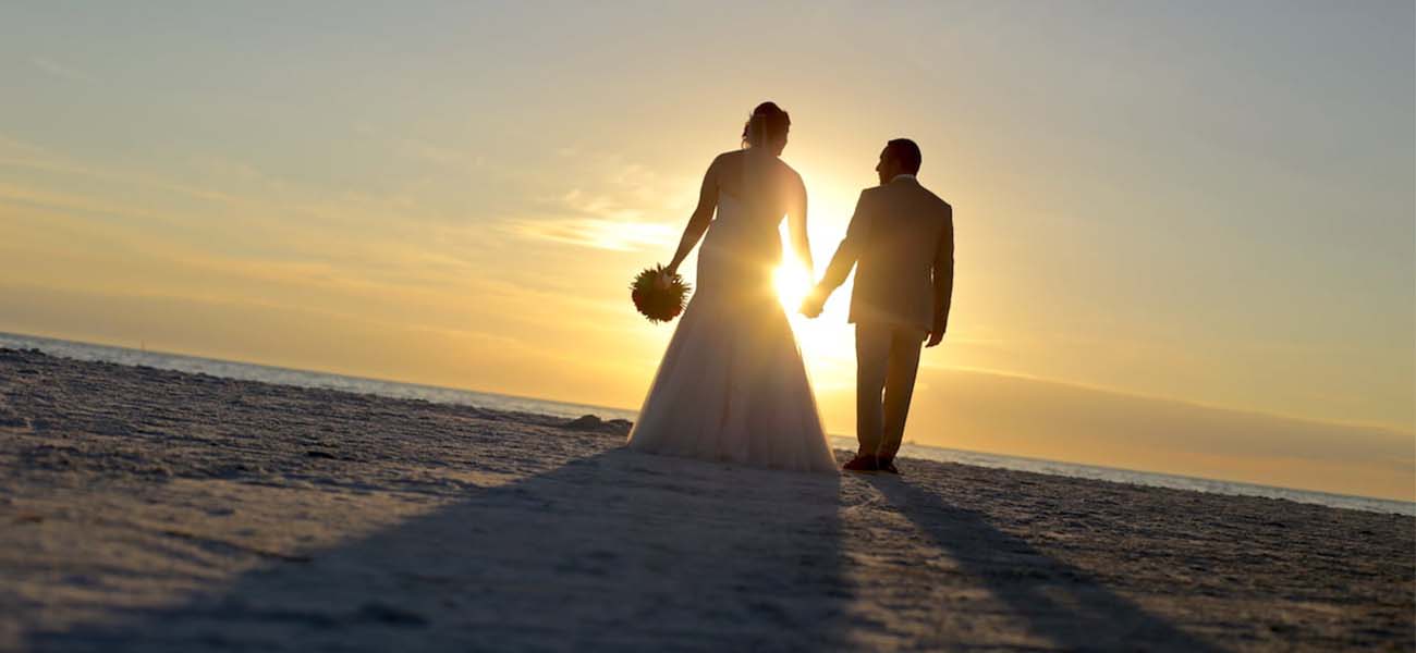 Bride and Groom Sunset Silhouette photo | Florida Beach Wedding Photography by Cristina Gebel