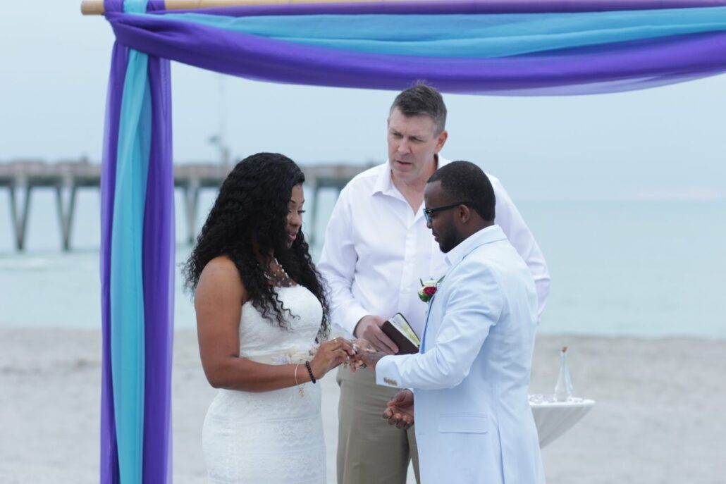 Bride and Groom at Blue Themed Florida Beach Wedding Ceremony