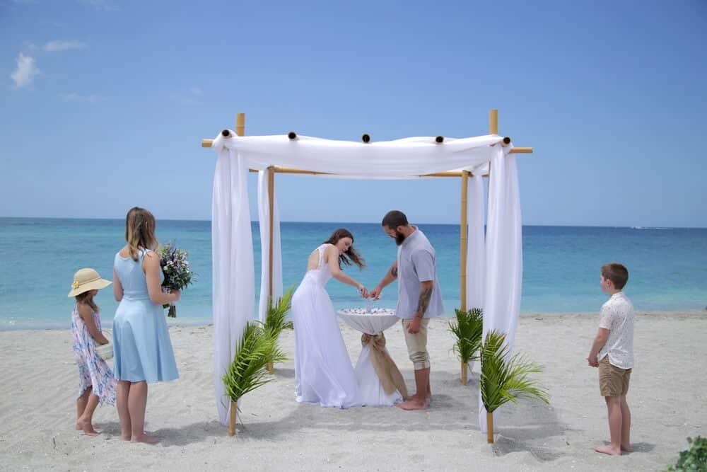 Destination Beach Wedding in Florida | Chuppah Bamboo Arbor and Sand Jar Ceremony