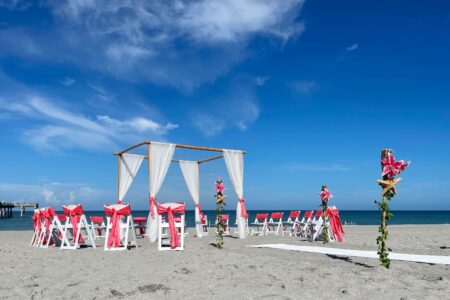 Circular Seating for Beach Wedding Ceremony in Coral and White | Affordable Florida Beach Wedding Packages