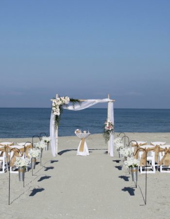 2023 Beach Wedding Inspiration | Asymmetrical Floral Beach Wedding Arch in Neutral Tones
