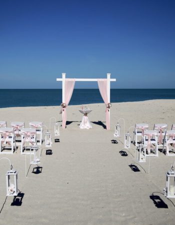 Pink and White Beach Wedding in Sarasota with Nautical Accents | Oceanfront beach wedding setup